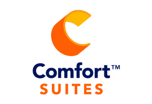Comfort Suites logo on a white background, featuring an orange and yellow crescent shape above the text 'Comfort Suites' in blue and orange.