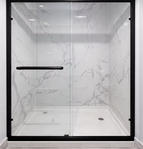 Modern shower enclosure with marble-patterned glass and black frame
